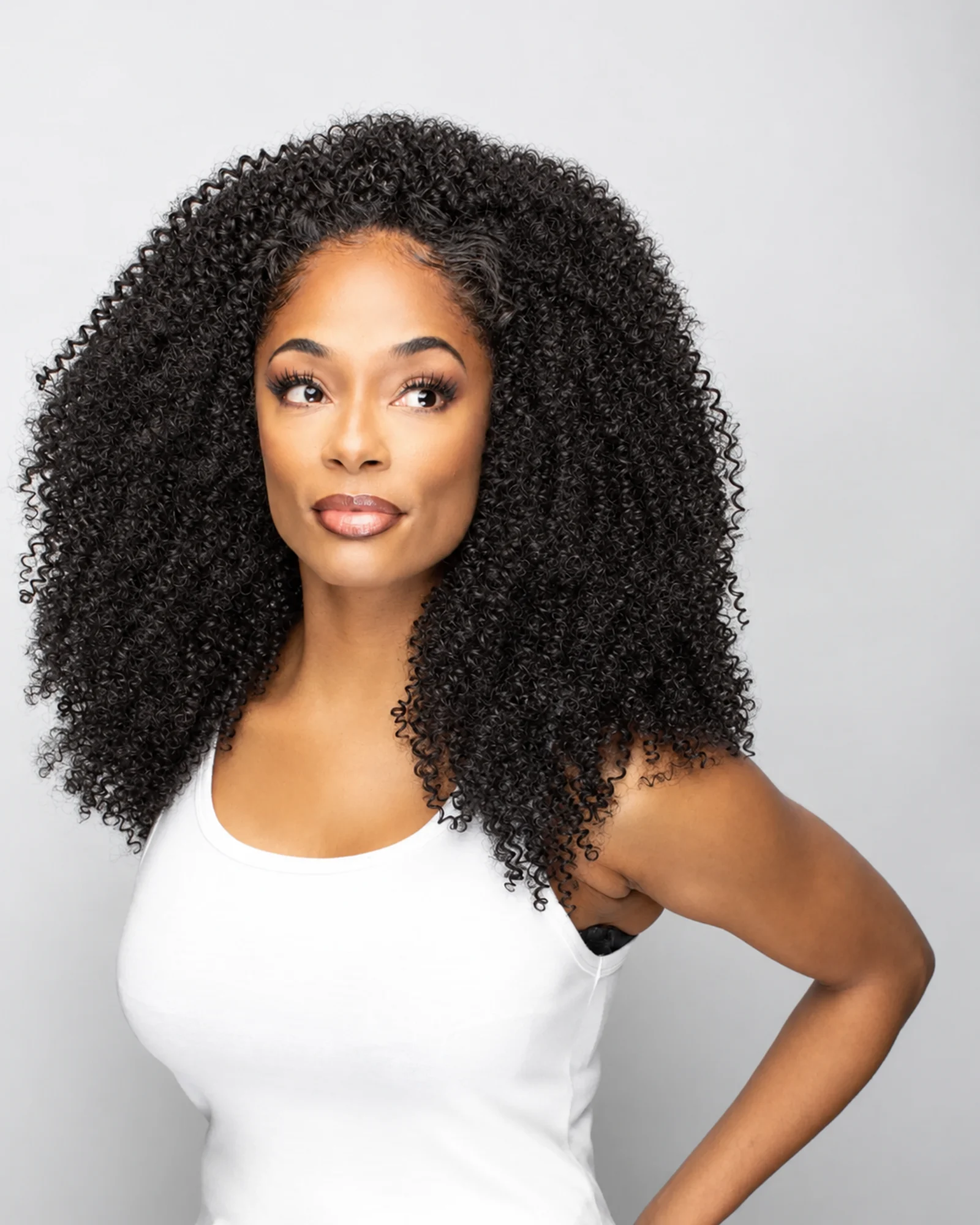 Woman with full, defined kinky curly hair